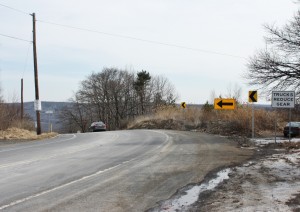 Pennsylvania Route 66 diverts abruptly past the berm blocking the abandoned Route 61.