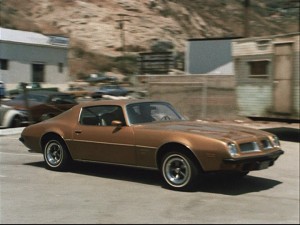 Jim Rockford races to the rescue (or the bar) in his trusty Pontiac Firebird Esprit.