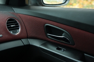 Red fabric inserts in the dash and doors contrasts nicely with the black interior.
