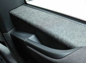 Lightweight carbon fiber-reinforced body panels are found throughout the interior.